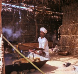 Stirring the cooking sugar cane juice